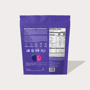 Back of a purple product package labeled 'Advanced Hydration. Powered by Nature.' with nutrition facts, icons, and illustrations of a blackberry and raspberry.