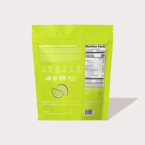 Back of a green product package showing nutrition facts, lime slices illustration, and product information text.